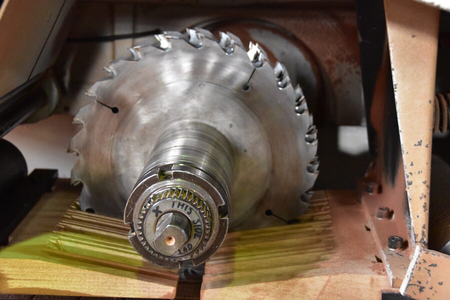 Carbide rip-saw blade on the gang rip saw at Estate Millwork