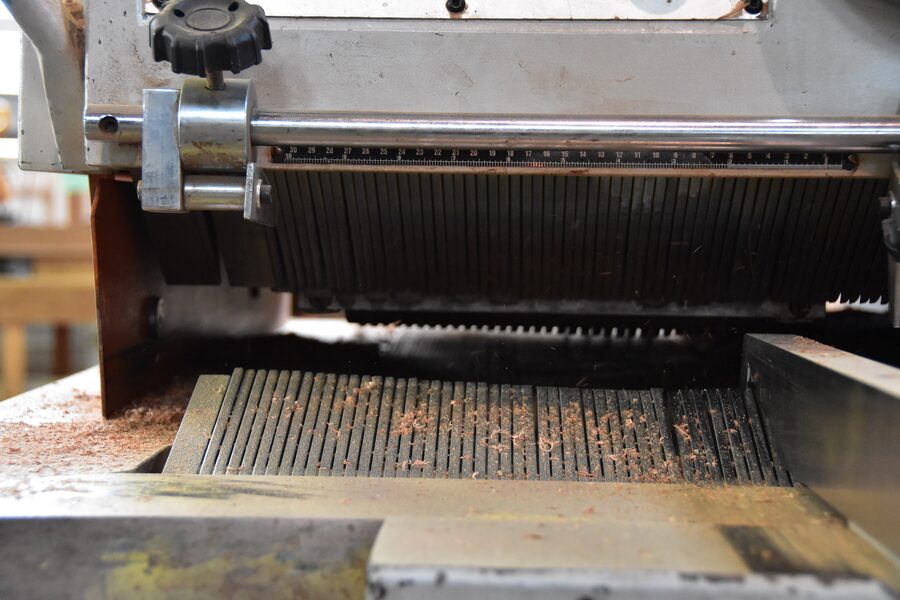 Gang rip saw ripping hardwood into door stiles at Estate Millwork