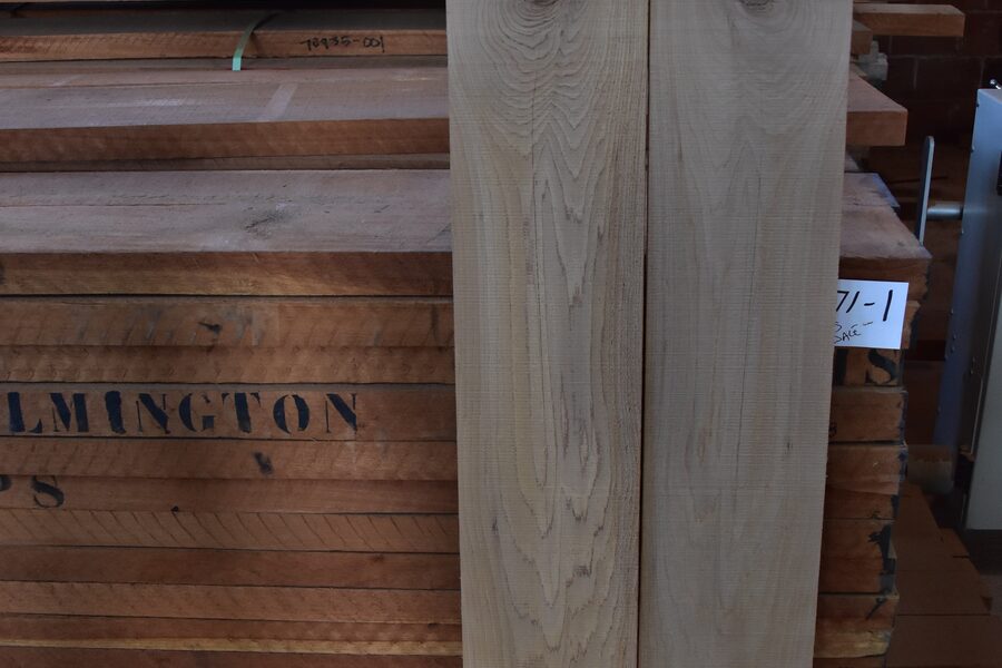 Mortise-and-tenon door stiles and rails staged for assembly at Estate Millwork