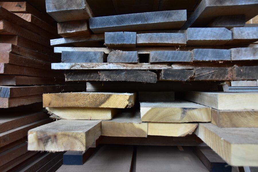 Stacks of premium rough hardwood lumber stored at Estate Millwork
