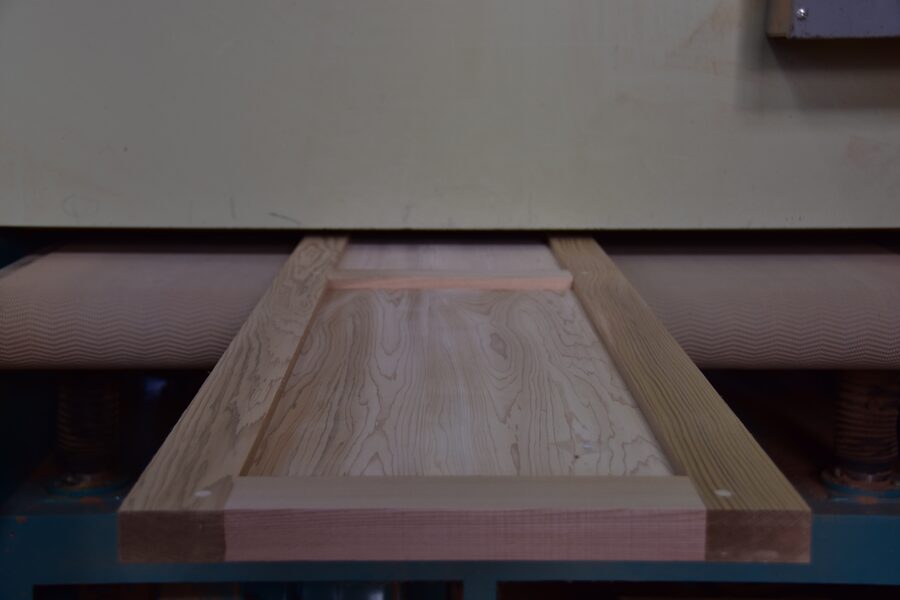 Finished solid raised panel door on the shop floor at Estate Millwork
