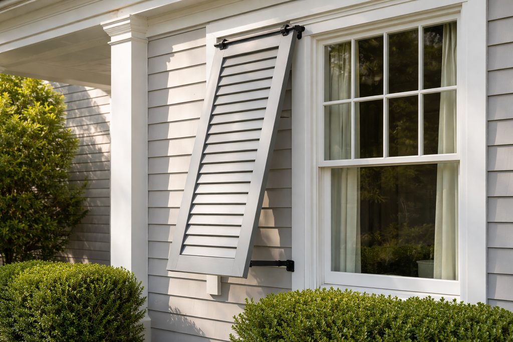 Solid Sapele bermuda shutters, custom handcrafted by Estate Millwork